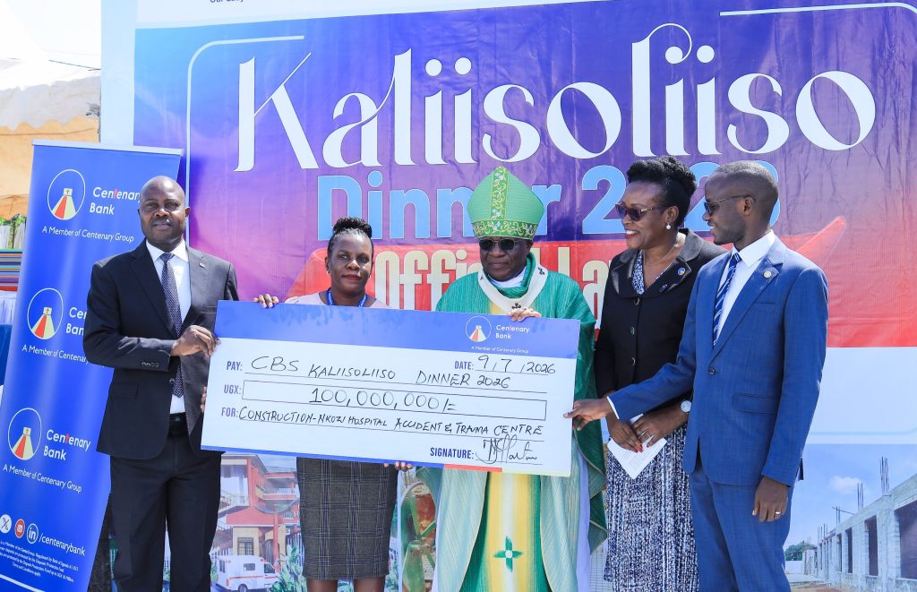 Centenary Bank handing over a dummy cheque of UGX 100 million towards the construction of the acident and trauma centre at Nkozi Hospital