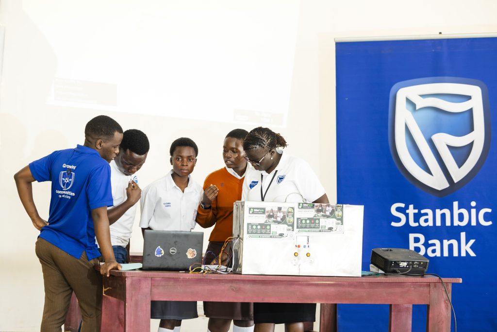 Stanbic Bank Manager Corporate Social Investment (CSI), Diana Ondoga interacting with the students