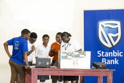 Stanbic Bank Manager Corporate Social Investment (CSI), Diana Ondoga interacting with the students
