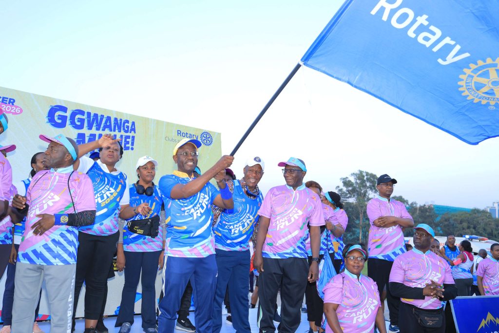 Centenary Bank Managing Director, Godfrey Byekwaso setting off runners at Kololo Independence Grounds during this year's Rotary Cancer Run