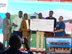 Namuganza presenting a a dummy cheque to. Kyambogo engineering students for their winning design