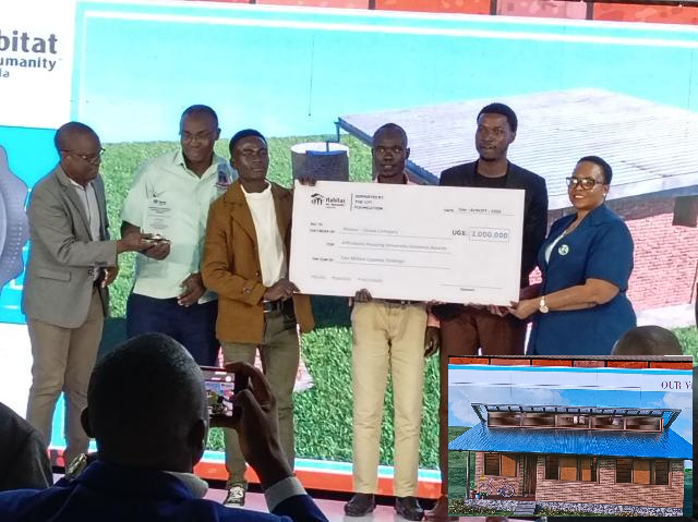 Namuganza presenting a a dummy cheque to. Kyambogo engineering students for their winning design