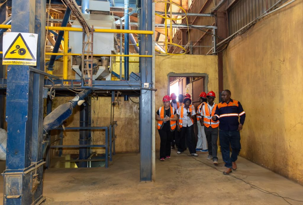A delegation of Equity Members touring the Coffee Processin plant at Zigoti Coffee Works Limited