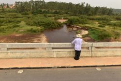 File photo, President Yoweri Museveni looks at what remains of River RwIzi when he toured a bridge built in Mbarara.