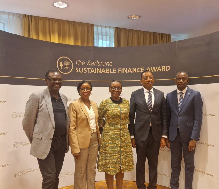 Housing Finance Bank executive teams take group photo after recieving the sustainability award.