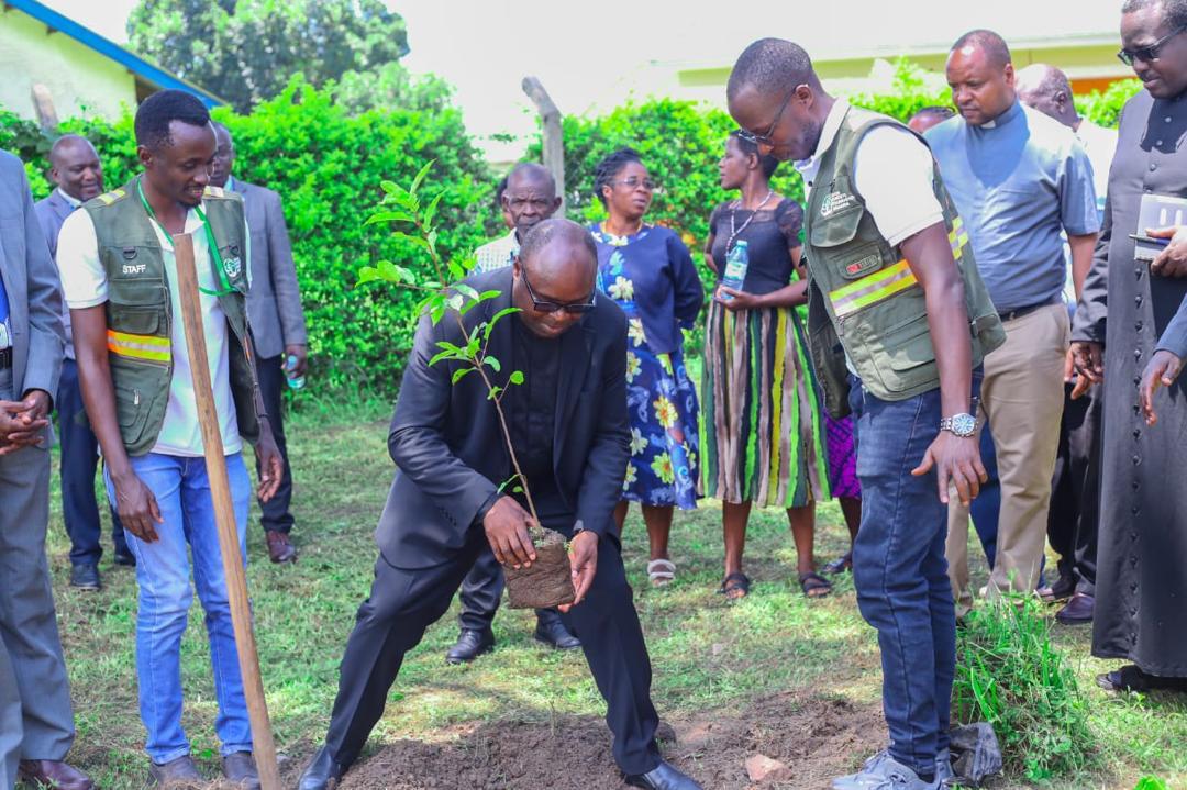 Kabale Diocese Vicar General, Fr.JohnVianney Sunday planting a tree in Nyamwegabira Parish, Kanungu district