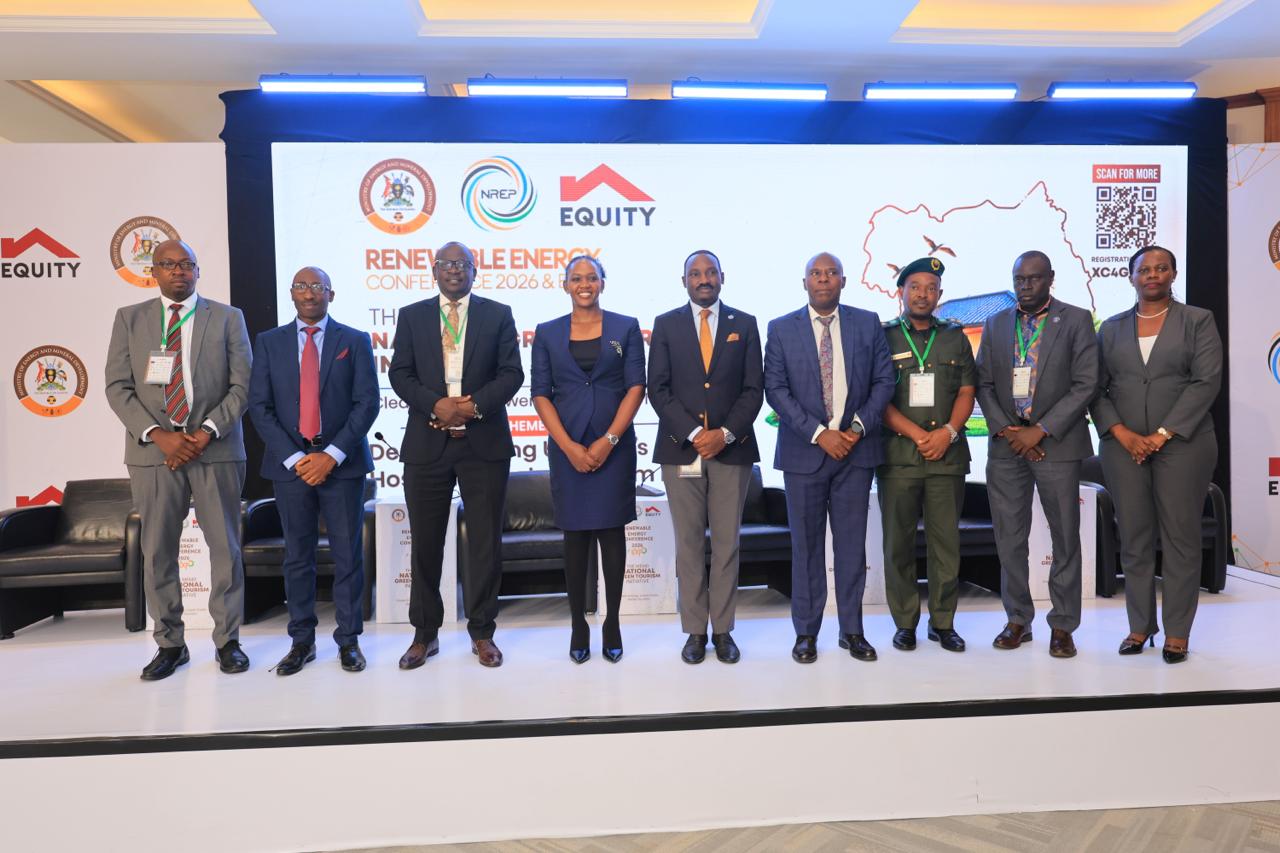 Minister of State for Energy and Mineral Development Phiona Nyamutoro(Thrid ftom Left) pasues with some of the panelists during the Conference