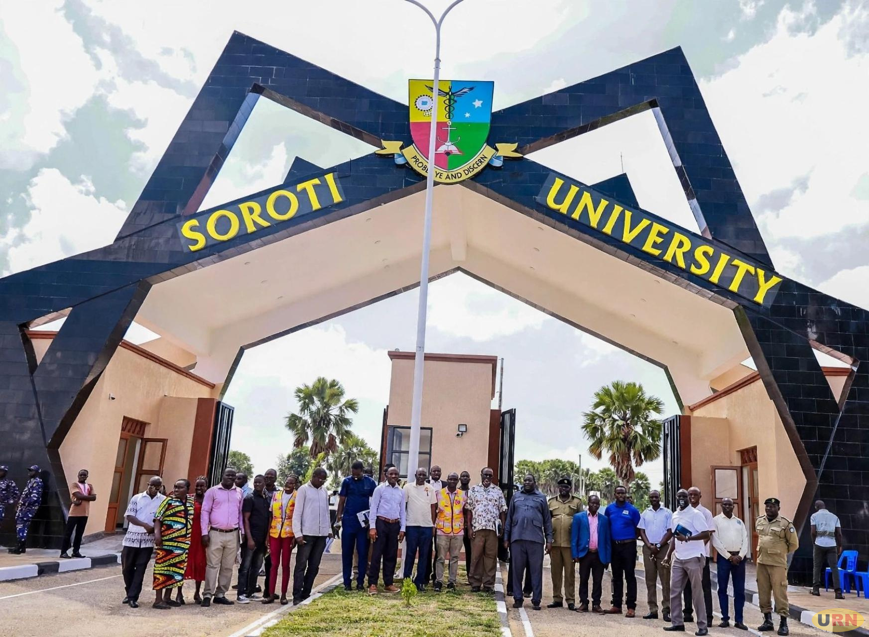 Officials pose for a photo during the commissioning of the Soroti University main gate three weeks ago